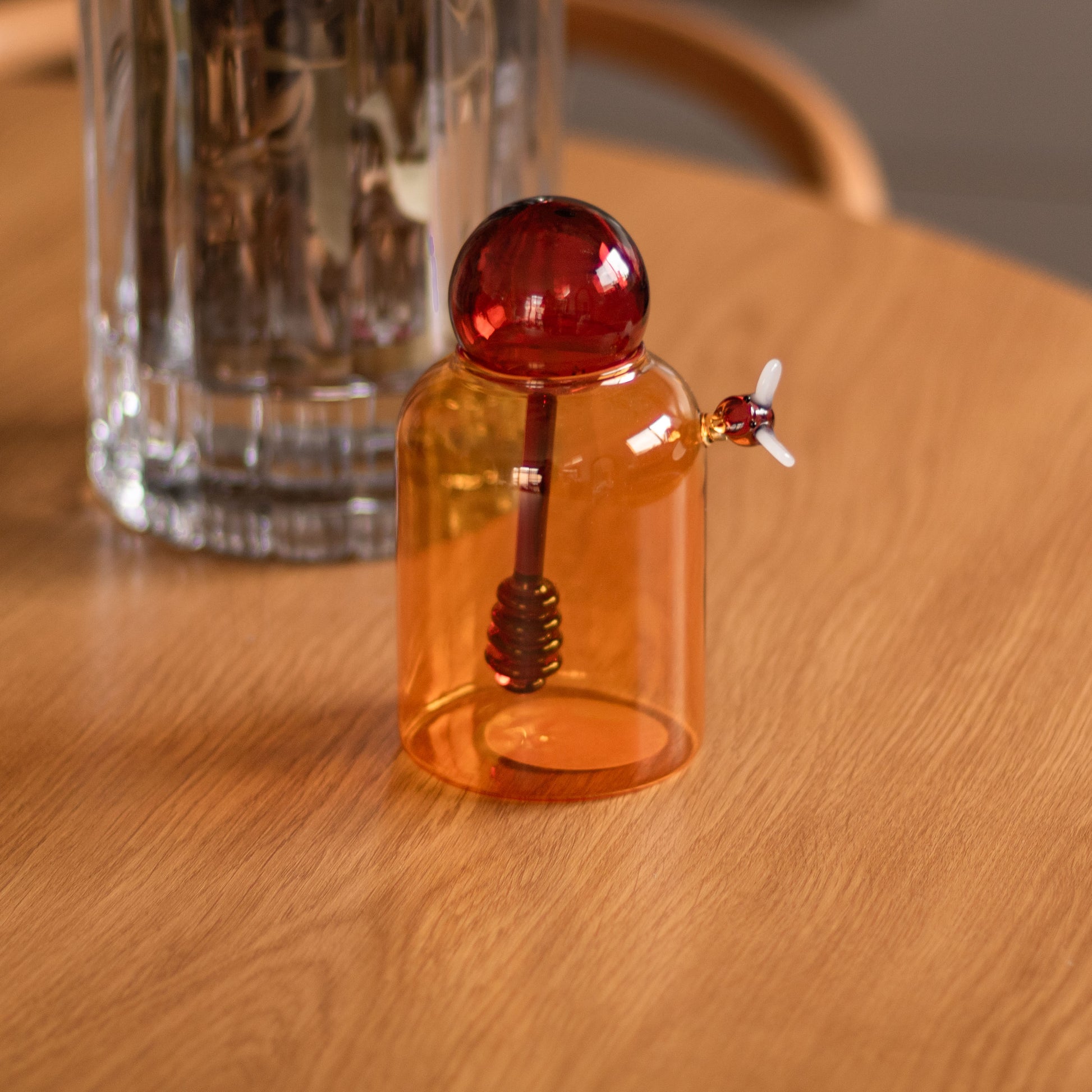 Shop our amber glass bumble bee honey jar with matching dipper. A playful kitchen piece for serving honey, syrup or styling on open shelves.