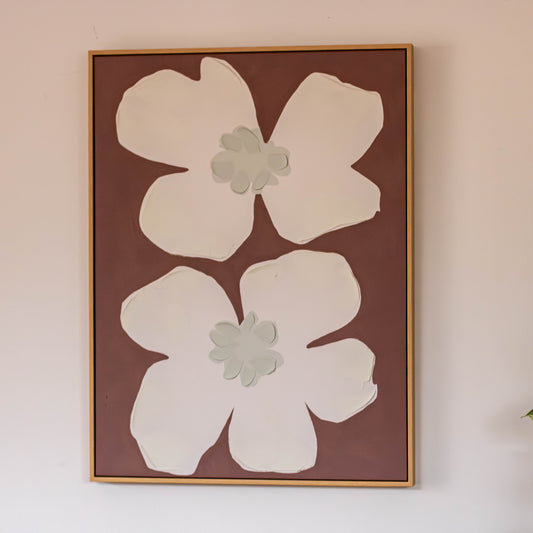 Featuring two oversized white blooms against a warm earthy background, this artwork feels simple, nostalgic and quietly playful. 