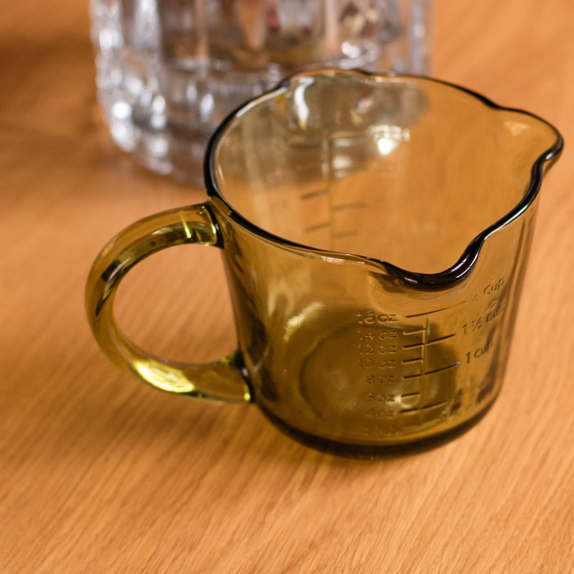 Shop our green glass measuring jug with embossed markings. Perfect for baking, cooking, sauces, dressings and retro kitchen styling.