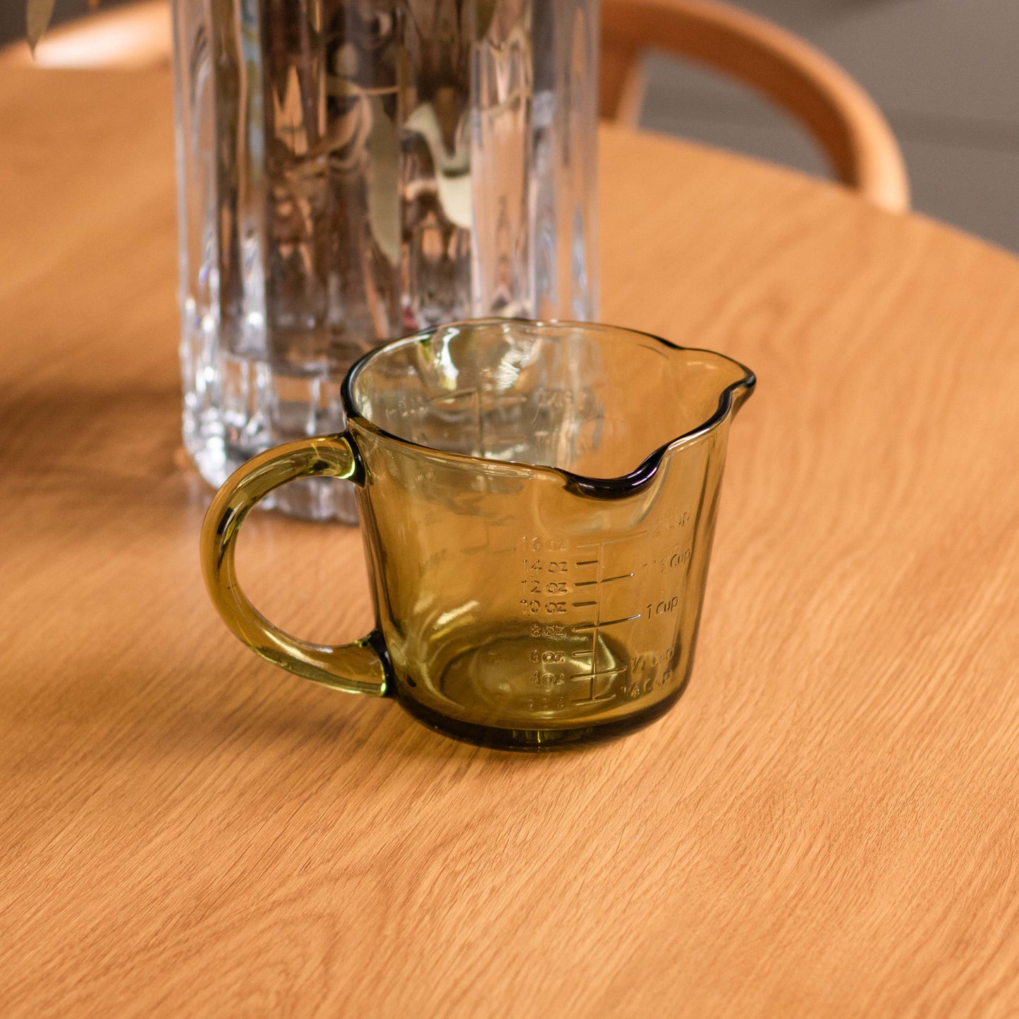 Shop our green glass measuring jug with embossed markings. Perfect for baking, cooking, sauces, dressings and retro kitchen styling.