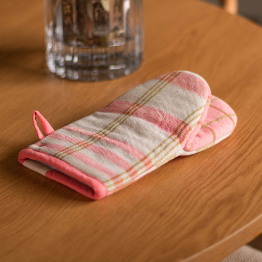 Shop our pink recycled cotton oven mitt with playful check design. A practical kitchen essential for baking, cooking and colourful styling.