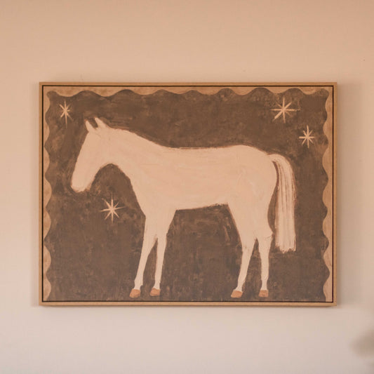 Featuring a soft white pony against a warm brown background with simple star details, this artwork has a sweet, nostalgic feel that adds character.